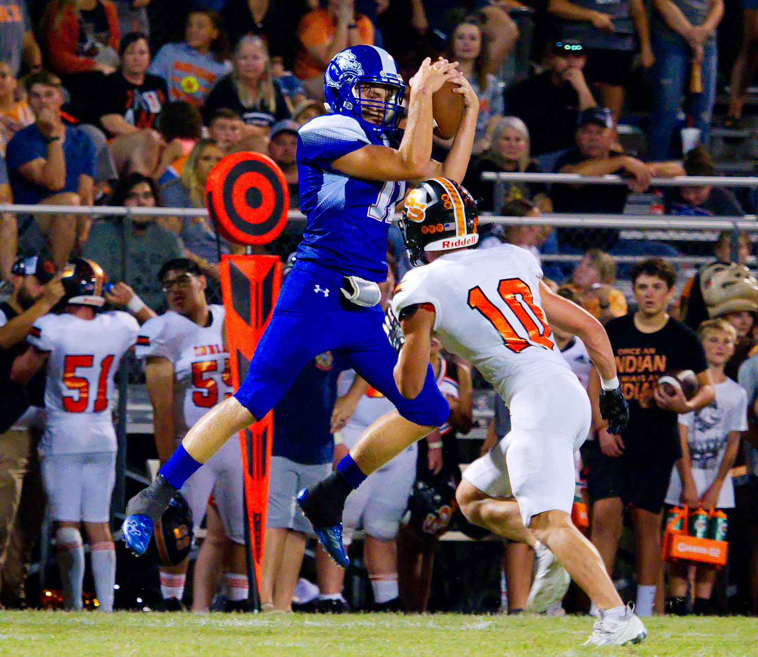 Klayton Meadows catches a streak pass to gain yardage for Quitman. [find more football photos]